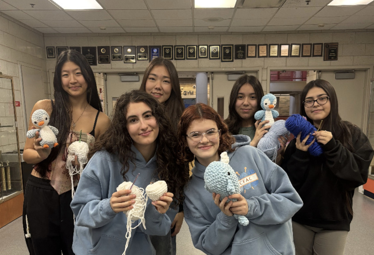Members crocheting during the Winter Wonderland Drive